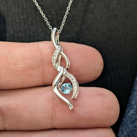 Sterling Silver Round Cut Sparkling Blue Topaz Infinity Pendant Necklace - Picture 4 of 9